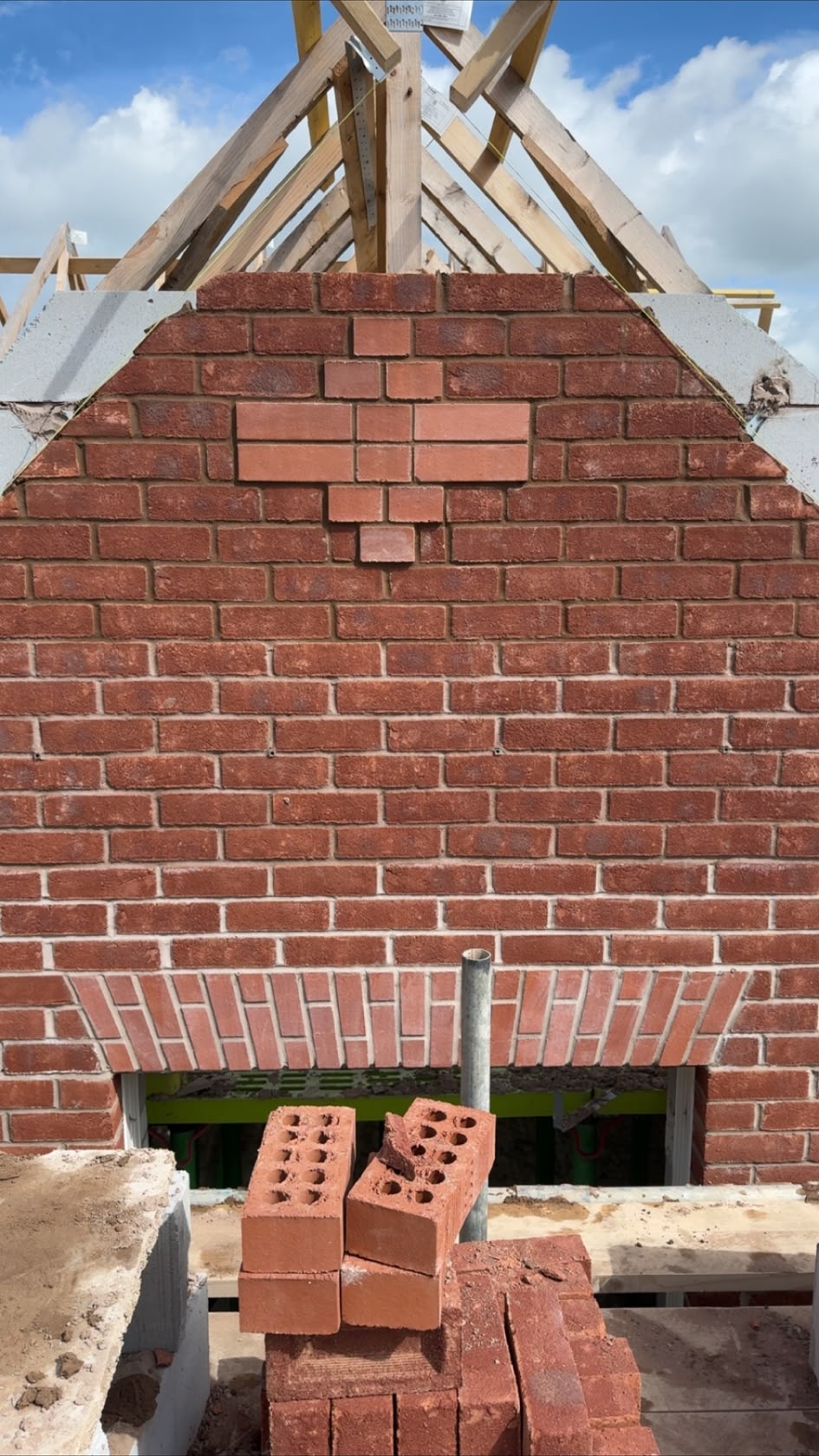 Decorative brick gable detail on a building under construction